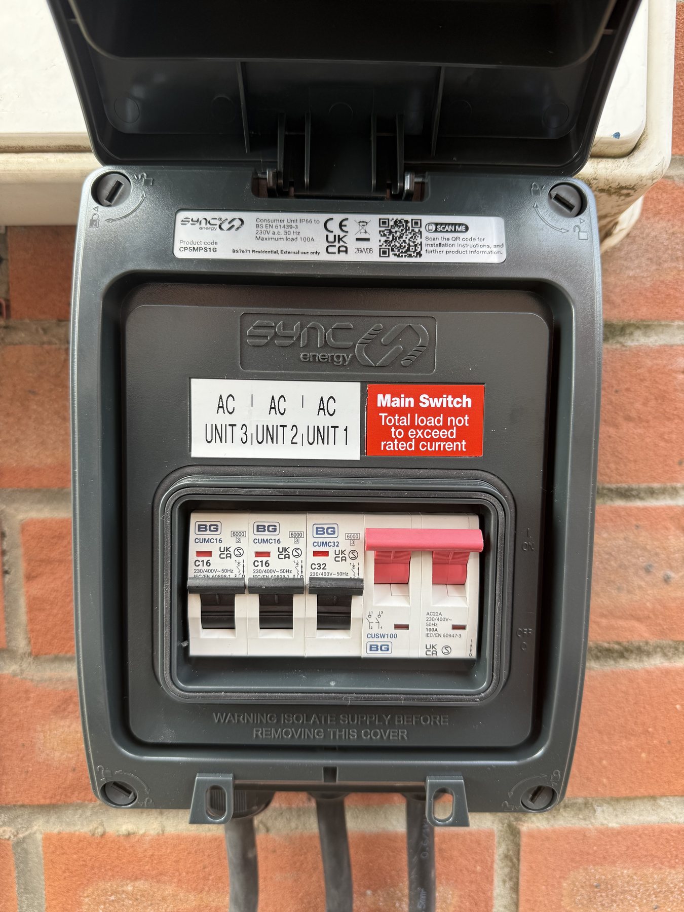 Open IP-rated external consumer unit with three labelled air-conditioning circuits